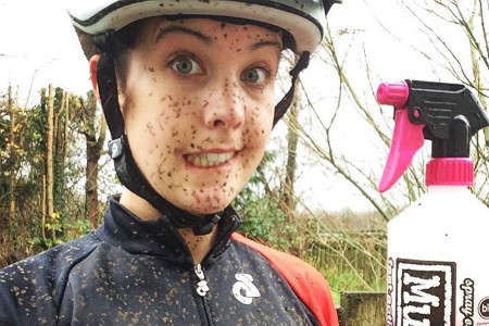 Danni with a Muc off bottle in her hand